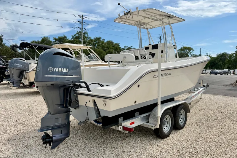 Slide: The Image of 2020 Cobia 237 Center Console boat with Yamaha engine on trailer. - 5