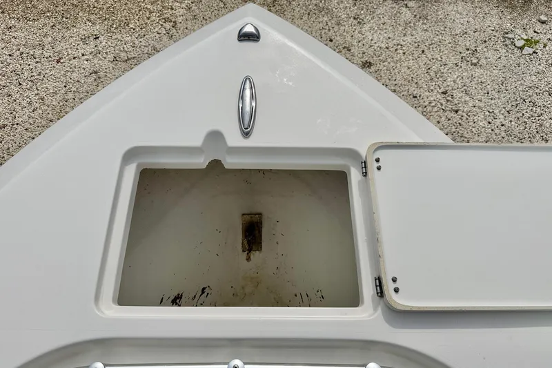 Slide: The Image of Bow storage compartment of a 2020 Cobia 237 Center Console boat. - 28