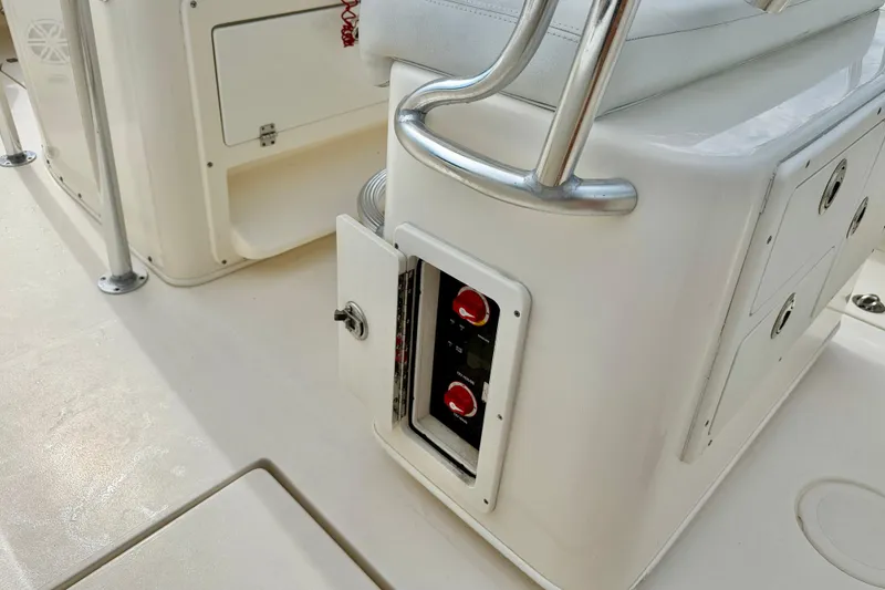 Slide: The Image of 2020 Cobia 237 Center Console boat interior with open electrical panel. - 24