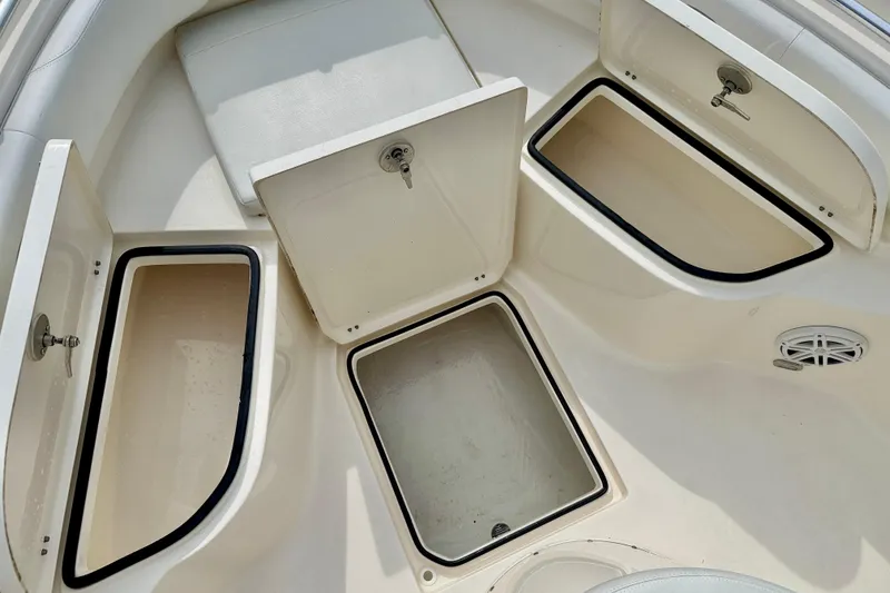 Slide: The Image of 2020 Cobia 237 Center Console boat storage compartments, open and spacious design. - 27