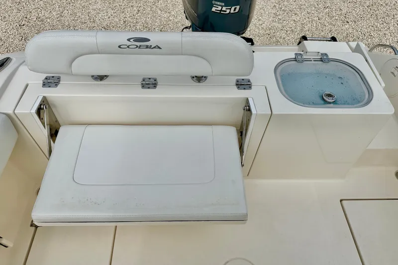 Slide: The Image of 2020 Cobia 237 Center Console boat with seating and livewell. - 26