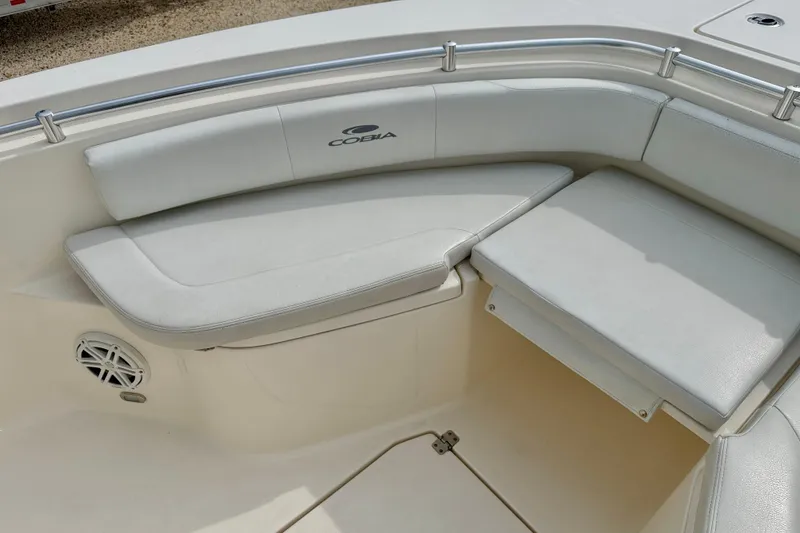 Slide: The Image of 2020 Cobia 237 Center Console boat interior with cushioned seating and speaker. - 9
