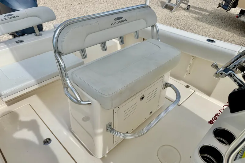 Slide: The Image of 2020 Cobia 237 Center Console boat interior with seating and steering wheel. - 15