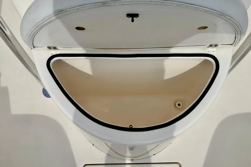 Slide: The Image of Storage compartment of a 2020 Cobia 237 Center Console boat, open and empty. - 29
