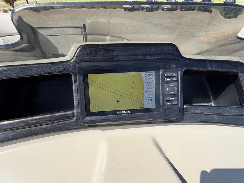 Slide: The Image of The image shows a Garmin navigation system on a boat, set into a dark dashboard. - 39