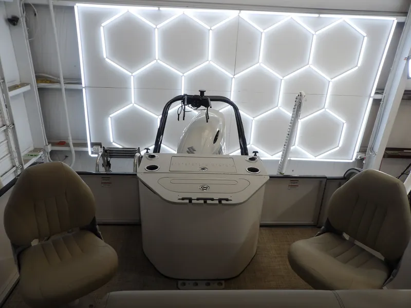 Slide: The Image of The image shows the cockpit of a 2022 SilverWave 2410 RLP SW3 with modern seating and a lit backdrop. - 16
