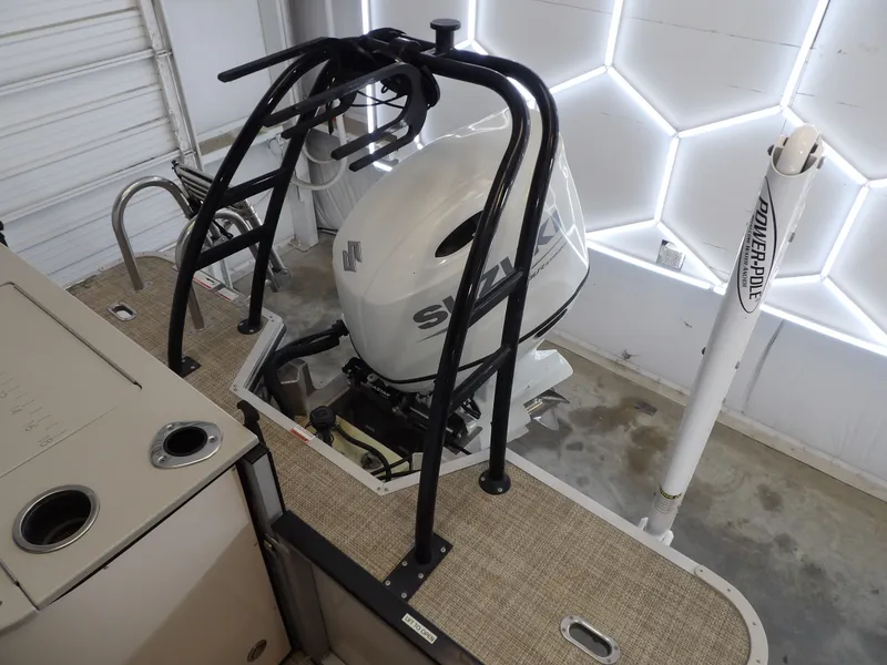 Slide: The Image of The image shows the engine area of a 2022 SilverWave 2410 RLP SW3 boat with a Suzuki outboard motor. - 10