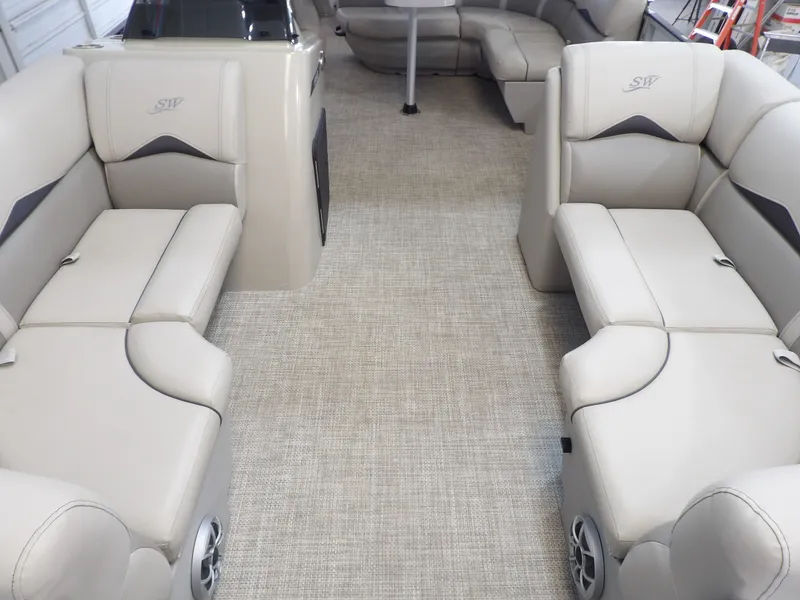 Slide: The Image of Interior of a 2022 SilverWave 2410 RLP SW3 with beige upholstered seating and carpeted floor. - 5