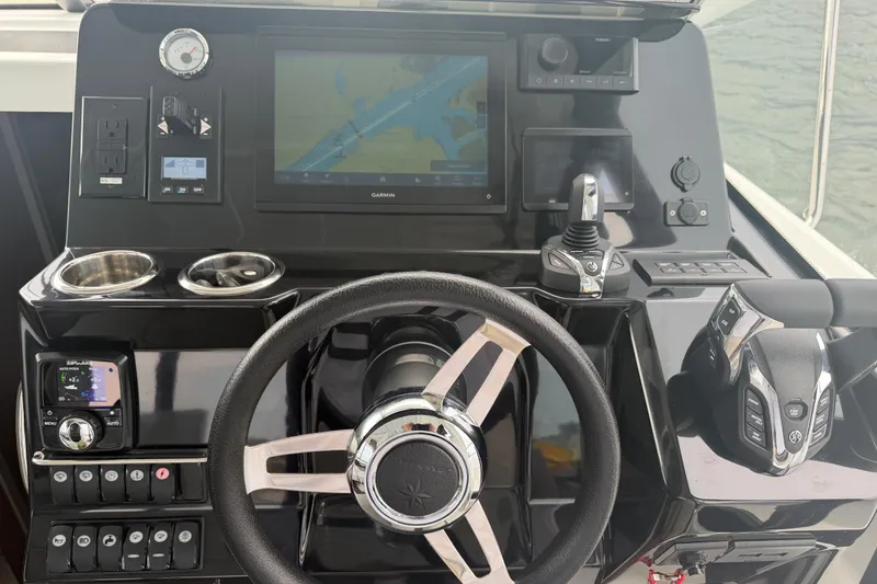 Slide: The Image of Helm of 2026 Jeanneau NC 1095 Coupe with advanced navigation and control systems. - 77