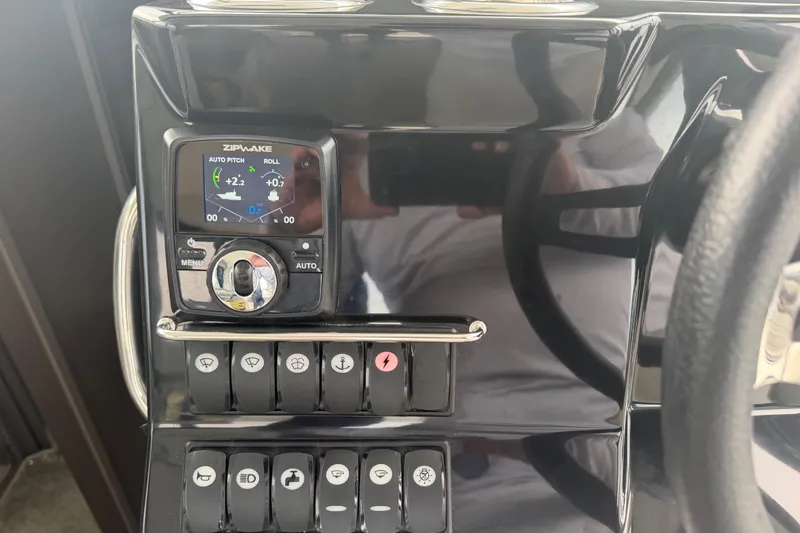 Slide: The Image of Control panel of 2026 Jeanneau NC 1095 Coupe with Zipwake auto pitch and roll display. - 78
