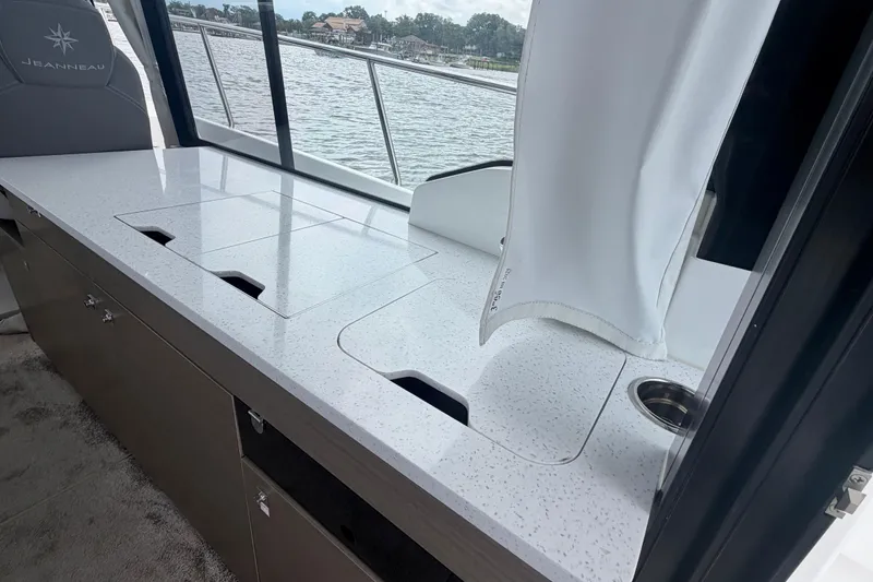 Slide: The Image of Modern kitchen area on 2026 Jeanneau NC 1095 Coupe yacht with sleek countertops. - 92