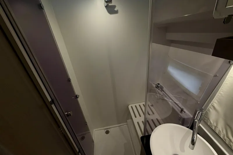 Slide: The Image of Bathroom interior of 2026 Jeanneau NC 1095 Coupe, featuring modern fixtures and compact design. - 109