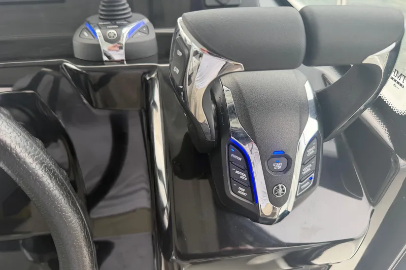 Slide: The Image of Control panel of a 2026 Jeanneau NC 1095 Coupe boat, featuring advanced throttle controls. - 79