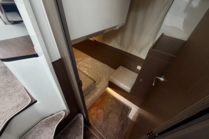 Slide: The Image of Interior cabin view of 2026 Jeanneau NC 1095 Coupe, featuring cozy sleeping area. - 111