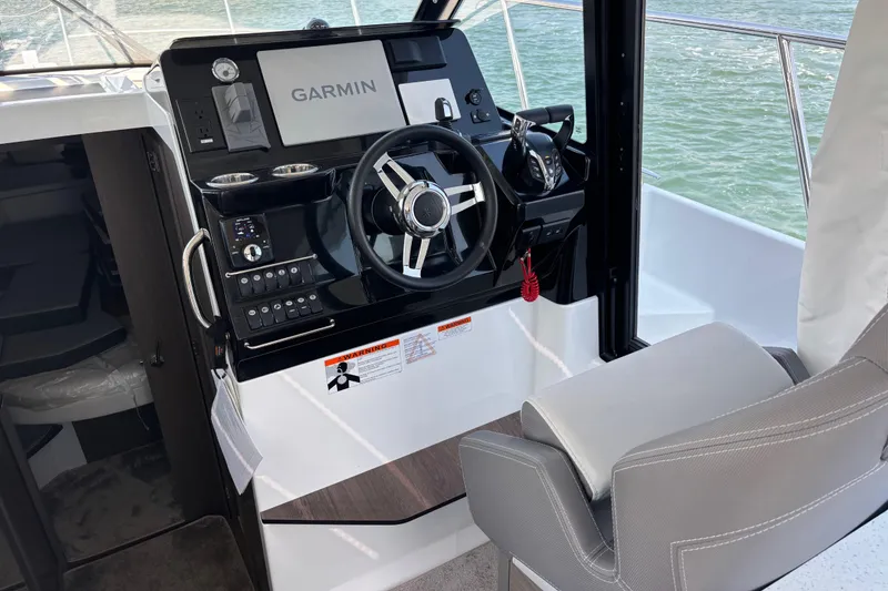Slide: The Image of Helm of 2026 Jeanneau NC 1095 Coupe Series 2 with Garmin navigation system. - 33