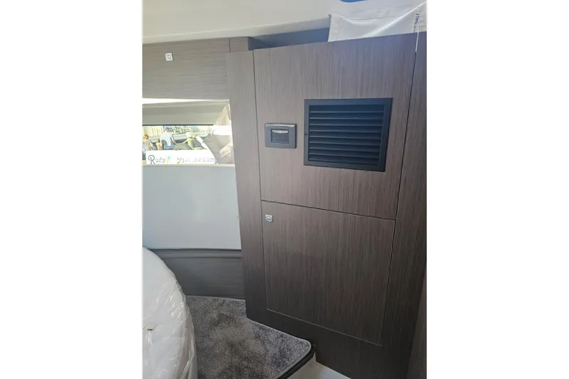 Slide: The Image of Interior of 2026 Jeanneau NC 1095 Coupe Series 2, featuring modern wood paneling. - 8