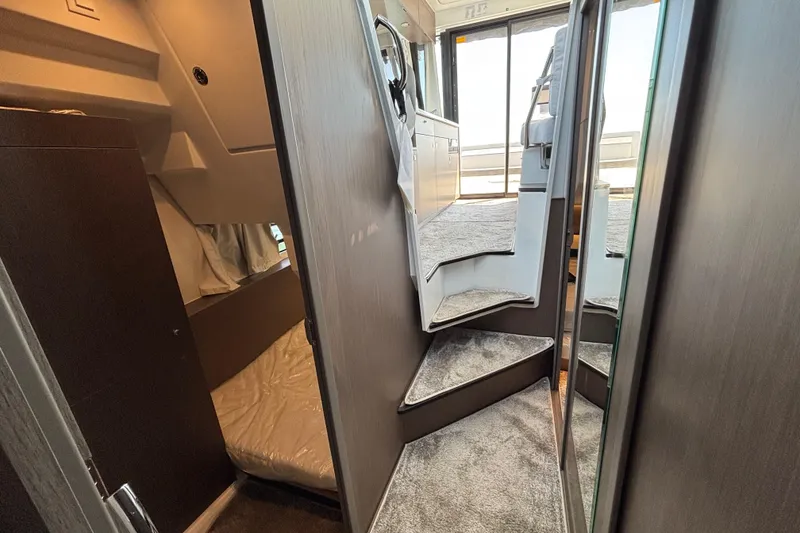 Slide: The Image of Interior view of 2026 Jeanneau NC 1095 Coupe Series 2, featuring stairs and cabin area. - 20