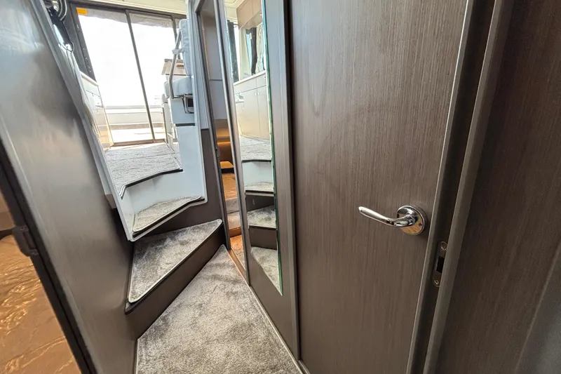 Slide: The Image of Interior stairs and door of 2026 Jeanneau NC 1095 Coupe Series 2 yacht. - 23