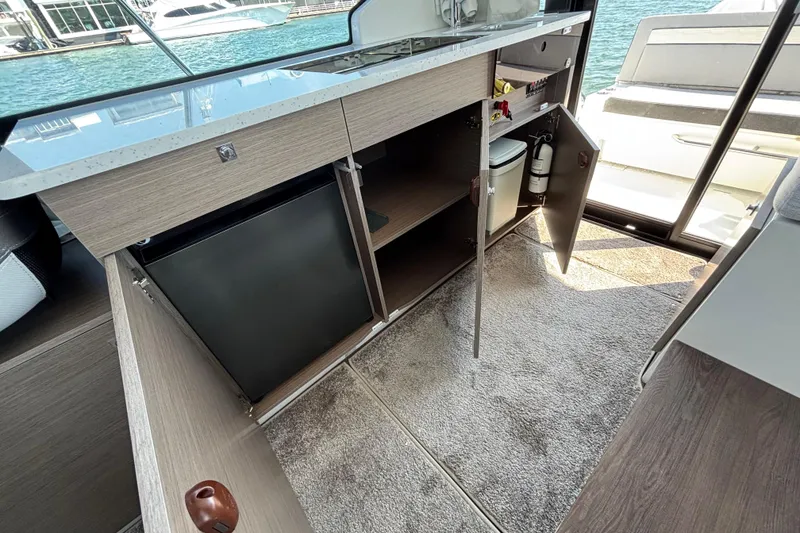 Slide: The Image of Interior view of 2026 Jeanneau NC 1095 Coupe Series 2 yacht kitchen area. - 29