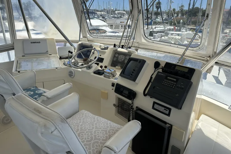 Slide: The Image of Interior view of 1998 Mikelson 43 Sportfisher helm with navigation equipment and controls. - 8