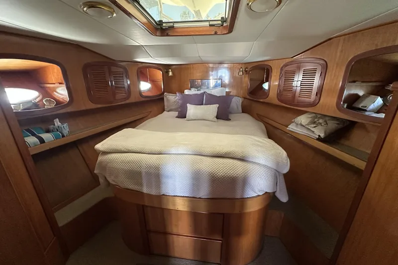 Slide: The Image of Luxurious cabin interior of 1998 Mikelson 43 Sportfisher yacht with cozy bedding. - 14