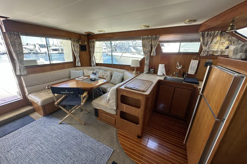 Slide: The Image of Interior of 1998 Mikelson 43 Sportfisher yacht with cozy seating and kitchenette. - 18