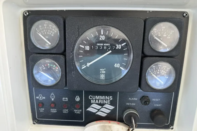 Slide: The Image of Instrument panel of a 1998 Mikelson 43 Sportfisher with Cummins Marine gauges. - 19