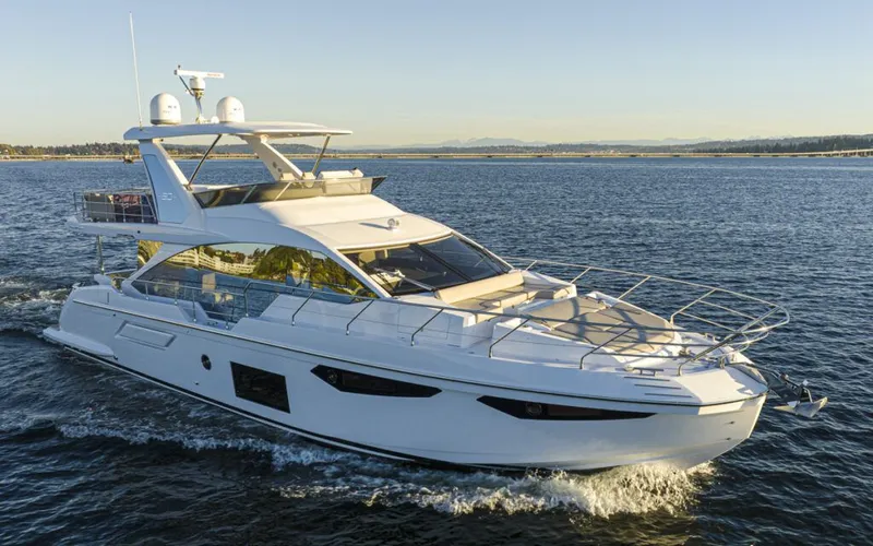 Slide: The Image of 2023 Azimut 60 Fly cruising on calm water. - 2