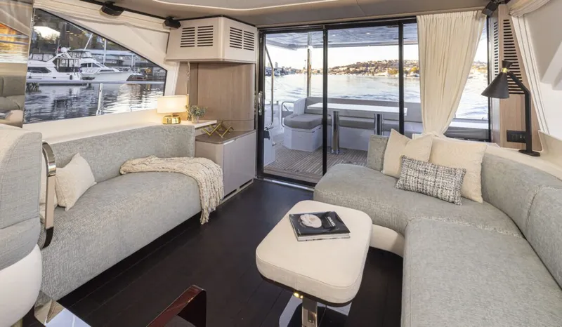Slide: The Image of Interior of a luxury yacht with modern furnishings and a view of the harbor. - 7
