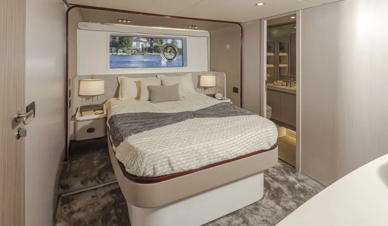 Slide: The Image of Luxurious cabin with a double bed, soft pillows, and stylish lighting. - 15