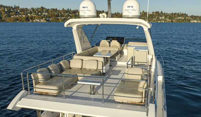 Slide: The Image of The image shows the upper deck of a 2023 Azimut 60 Fly on the water. - 6