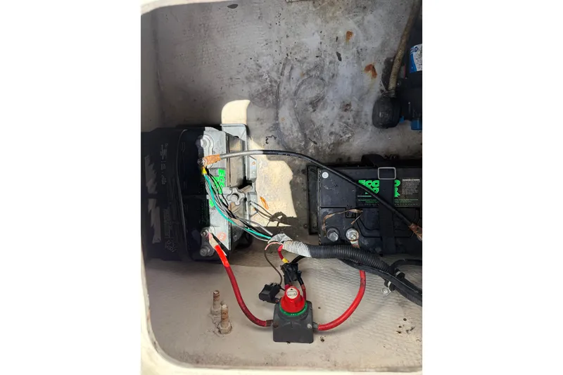 Slide: The Image of Battery compartment of 2012 Hurricane SunDeck Sport 188 OB boat with wiring connections. - 4