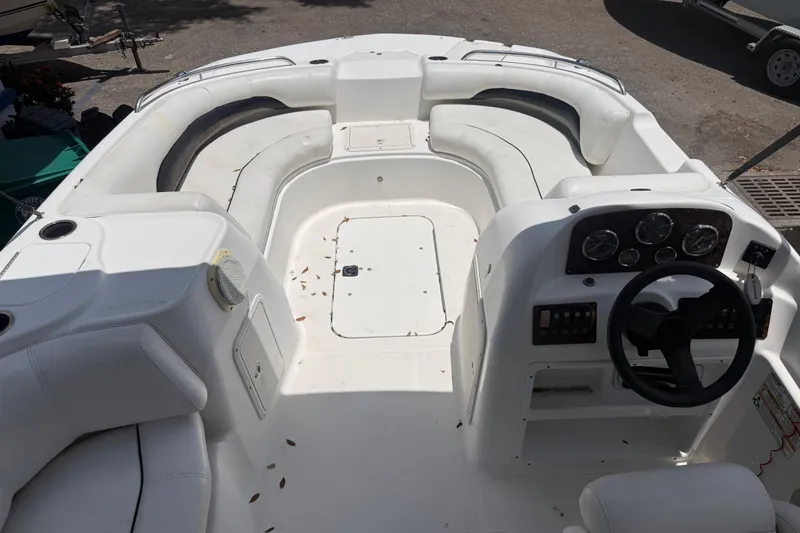 Slide: The Image of 2012 Hurricane SunDeck Sport 188 OB boat interior with seating and control panel. - 7