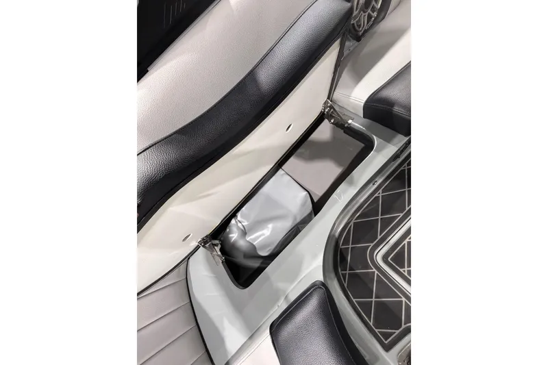 Slide: The Image of 2024 MB B52 23 Classic boat interior storage compartment with sleek design and modern upholstery. - 64