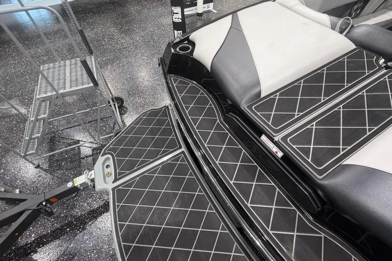 Slide: The Image of 2024 MB B52 23 Classic boat interior with diamond-patterned flooring and seating. - 56