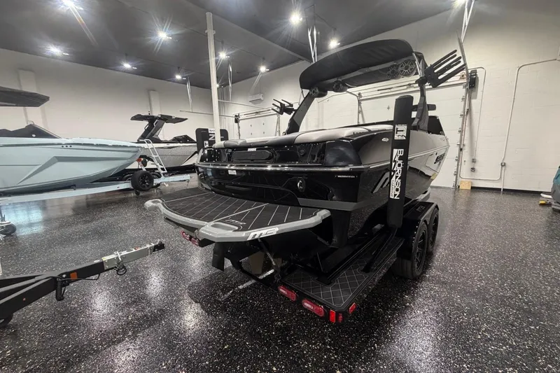 Slide: The Image of 2024 MB B52 23 Classic boat on trailer in showroom. - 9