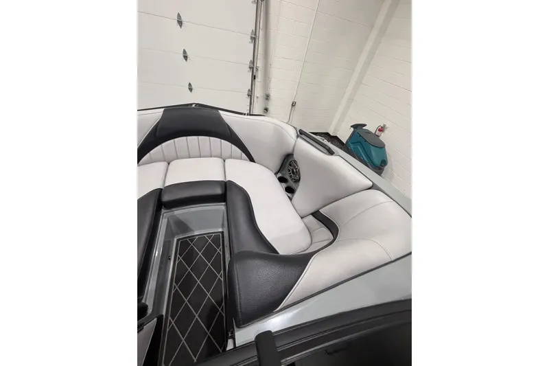 Slide: The Image of 2024 MB B52 23 Classic boat interior with sleek black and white seating design. - 13