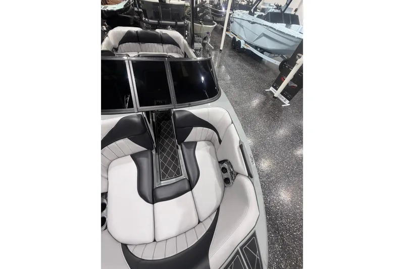 Slide: The Image of 2024 MB B52 23 Classic boat interior with sleek black and white seating design. - 20