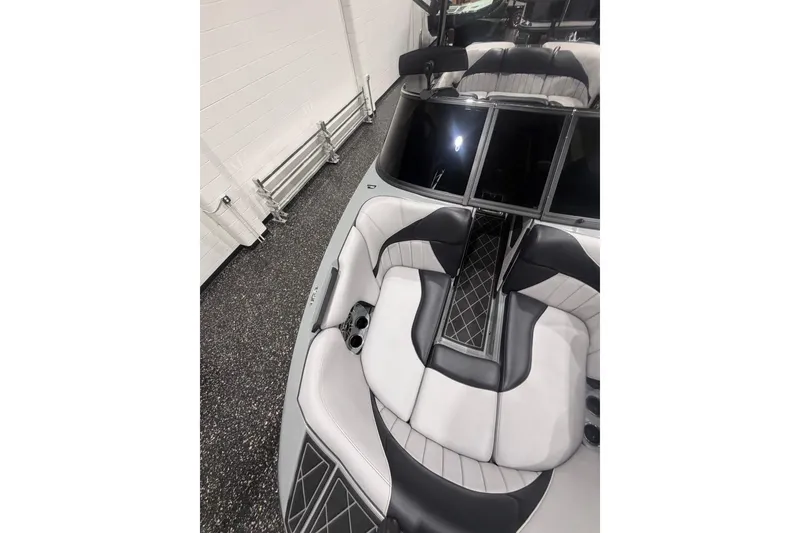 Slide: The Image of 2024 MB B52 23 Classic boat interior with sleek black and white seating design. - 19