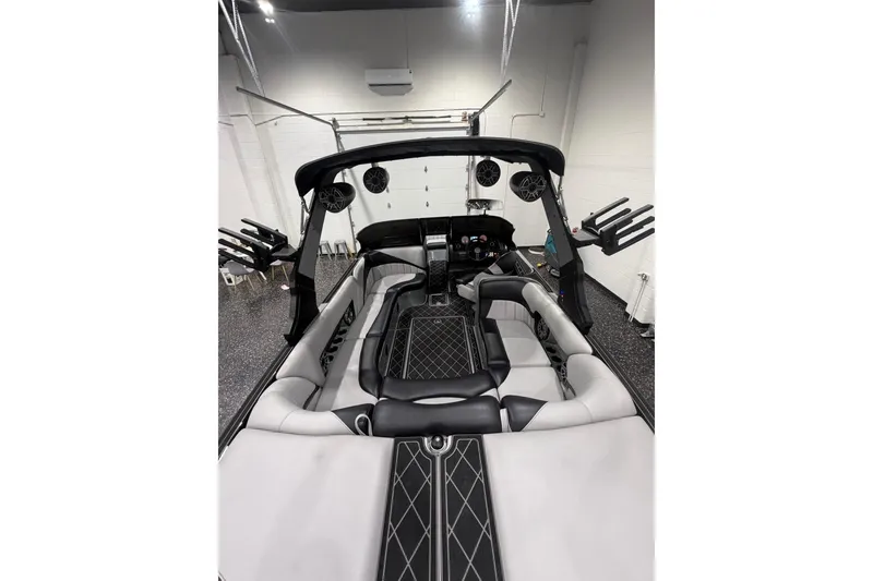 Slide: The Image of 2024 MB B52 23 Classic boat interior with sleek seating and modern design in a showroom. - 57