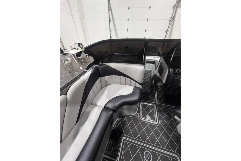 Slide: The Image of Luxurious interior of 2024 MB B52 23 Classic boat with elegant seating and flooring. - 27
