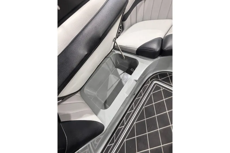 Slide: The Image of 2024 MB B52 23 Classic interior storage compartment with black and white seating. - 63