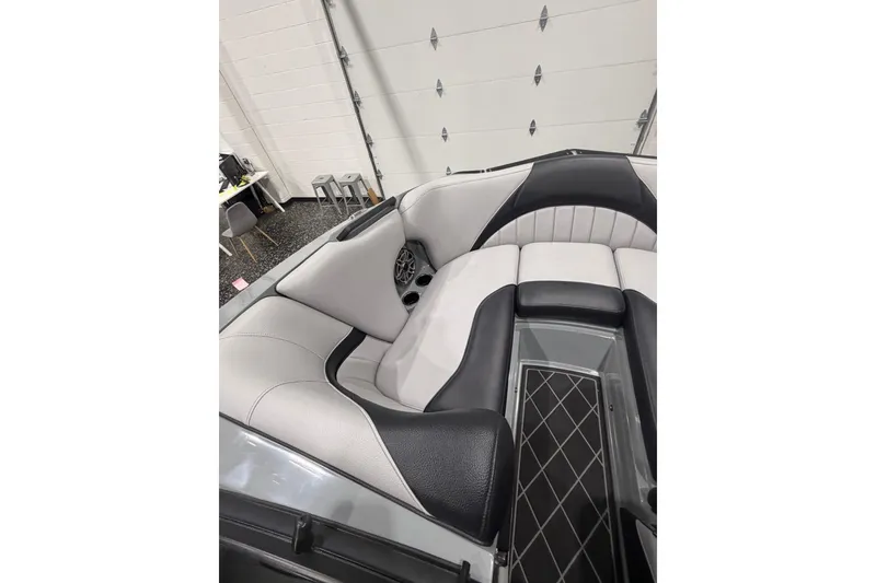 Slide: The Image of 2024 MB B52 23 Classic boat interior with sleek black and white seating. - 11