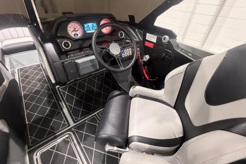 Slide: The Image of Interior of 2024 MB B52 23 Classic boat with modern dashboard and seating. - 33