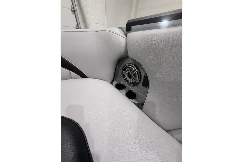 Slide: The Image of Interior of 2024 MB B52 23 Classic boat featuring speaker and cup holders. - 15