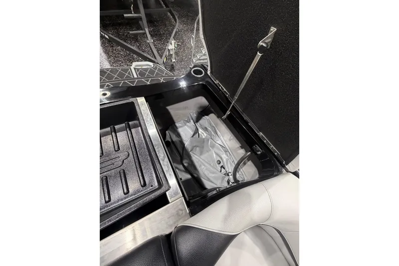 Slide: The Image of Open storage compartment in 2024 MB B52 23 Classic boat, featuring sleek interior design. - 61