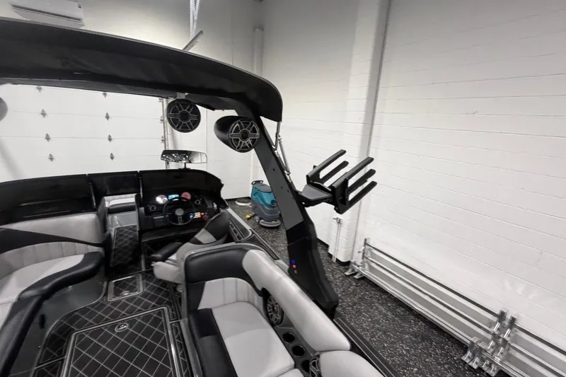Slide: The Image of Interior of 2024 MB B52 23 Classic boat with sleek seating and audio system. - 51