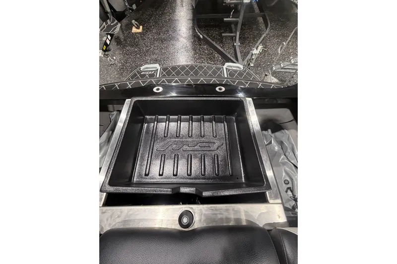 Slide: The Image of 2024 MB B52 23 Classic boat interior with storage compartment and textured flooring. - 60