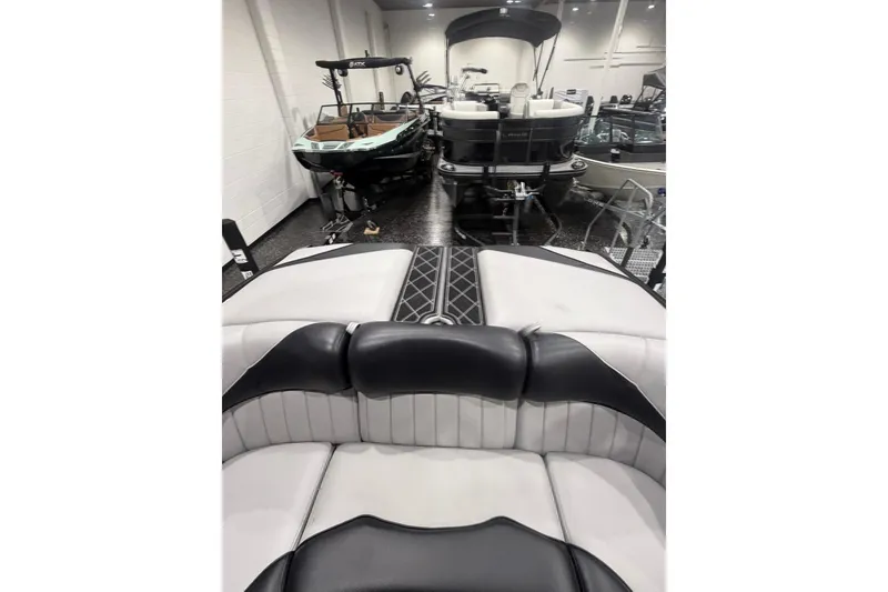 Slide: The Image of 2024 MB B52 23 Classic boat interior with sleek black and white seating. - 46