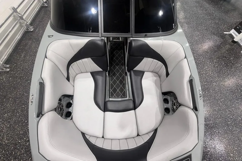 Slide: The Image of 2024 MB B52 23 Classic boat interior with sleek, modern seating and cup holders. - 17
